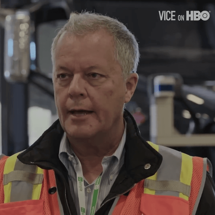 Chuck Price wears a hi-viz vest and hard hat as he speaks with Vice News reporter Krishna Andavalou